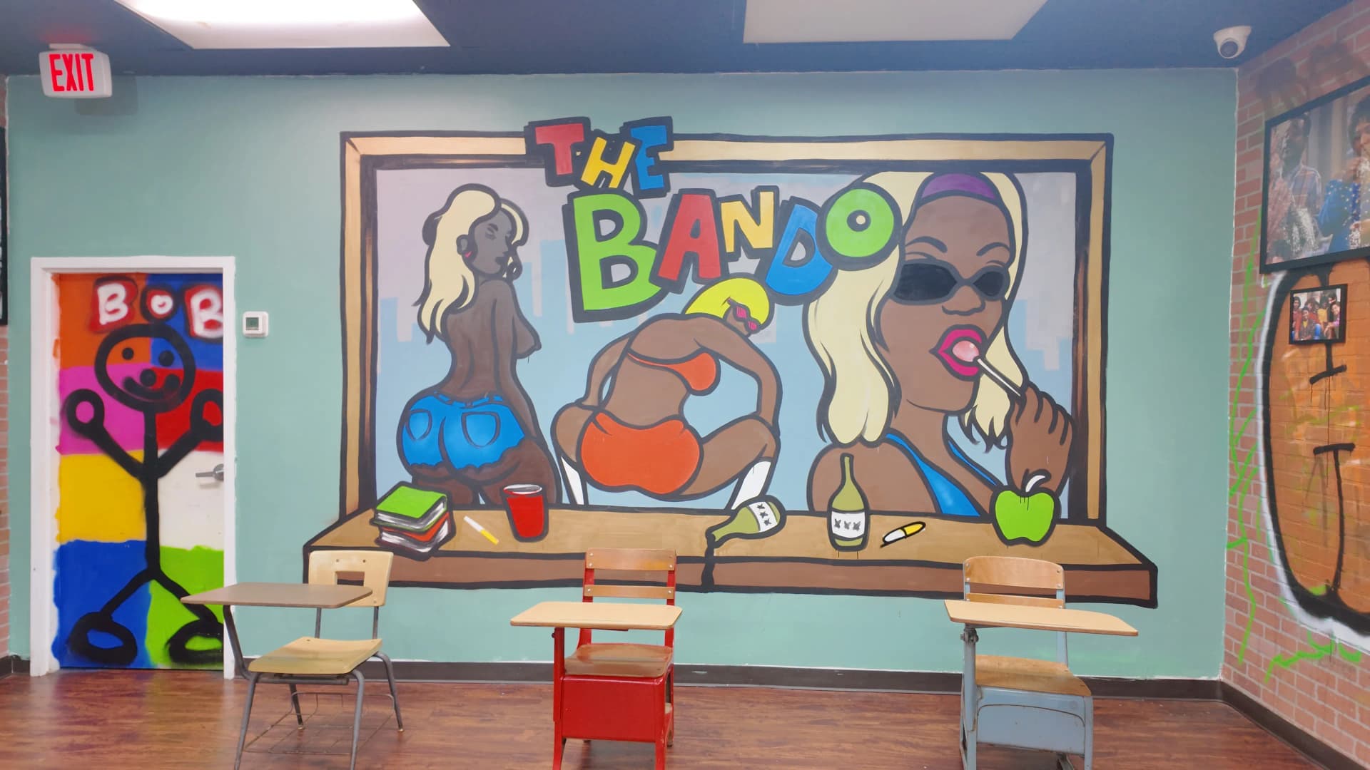 TheBando colorful mural and seating area, bold artwork that carries the restaurant's Westside Atlanta cultural identity