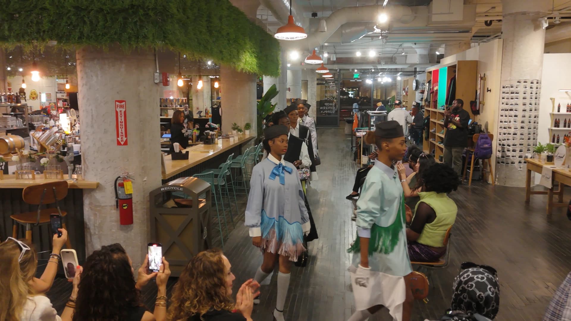 Models showcasing Aysegul Ikna sustainable fashion designs at the Ponce City Market runway event
