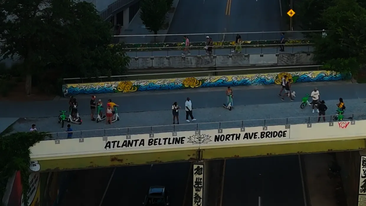 Walkers and cyclists crossing the Atlanta Beltline North Ave. Bridge